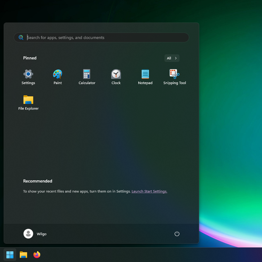 Image of a Windows 11 Start Menu. The applications pinned are Settings, Paint, Calculator, Clock, Notepad, Snipping Tool, and Explorer. The Recommended section is disabled and empty.